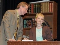 A scene from LET GO! A THERAPEUTIC MUSICAL, playing at Footlighters Theater of Berwyn. (L. to R. Danny Patrick Scott as "Dr. Phil O'Pillman" and Debbie Fair as "Renee").
