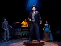 Greg Wood (center) as Phileas Fogg sails through a typhoon with his fellow travelers (from left: Dan Hodge, Benjamin Lloyd and Farah Bala) on their way to America in Delaware Theatre Company's AROUND THE WORLD IN 80 DAYS, playing in Wilmington DE through December 19. (Photo credit: Matt Urban)