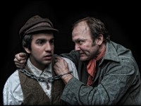 (l. to r.) Eric Scotolati portrays Pip and Paul Kuhn portrays Magwich in Curio Theatre Company’s production of GREAT EXPECTATIONS. (Photo credit: Kyle Cassidy)