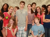 The cast of 13 THE MUSICAL: New kid Evan Goldman tries to find his way in a sea of unfamiliar faces (Front row: Jared Kirsch, Caroline Purdy, Matthew Blazejewski; Standing: J Scott, Melissa Geerlof, Karaline Rosen, Tanner Mead, Meredith Brandt, Wesley Cappiello, Ellen Rothfuss, Uvay Trivedi and Natalia Maccaroni; Not pictured: Nicky Rosolino).