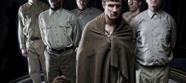 The cast of Curio Theatre Company's SLAUGHTERHOUSE-FIVE: (l. to r. - standing) Josh Hitchens, Jerry Rudasill, Ryan Walter, Steve Carpenter, Ken Opdenaker and Paul Kuhn, (sitting) Jennifer Summerfield.