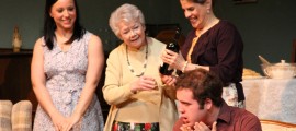 Caitlin (Michelle Paschetta of Folsom) brings a bottle of wine for dinner, impressing Emma (Ann Wood of Media) and Aida (Susan Triggiani of Springfield) while Nick (Matthew Prince of Media) realizes he's been set up, in OVER THE RIVER AND THROUGH THE WOODS, at The Players Club of Swarthmore, running through March 31.