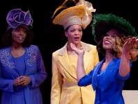 From left: Velma (Donna Jones of Wilmington) and Wanda (Kimberly S. Fairbanks of Lansdowne, PA) admire Jeanette’s (Lauren Blackwell) feathered hat in CROWNS at Delaware Theatre Company. (Photo credit: Matt Urban)
