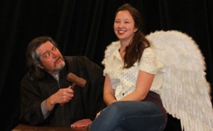 Jim Fryer of Lansdowne, as a feisty judge from Georgia, raps the gavel on an angel played by Alyssa Noel Dytko, in The Last Days of Judas Iscariot, running at the Players Club of Swarthmore through March 9.