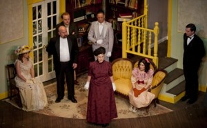 Front: Katie Kolacki as Miss Prism. Back: (L-R)Tess Pohlhaus as Gwendolyn, Bill Campbell as Dr. Chasuble, Charlie Johnson as Moulton, John Mulvey as Merriman, Madi Houff as Cecily, Sam White as Notlane in THE IMPORTANCE OF BEING EARNEST at Milburn Stone Theatre. (Photo credit: Scott Serio, Cecil Scene)