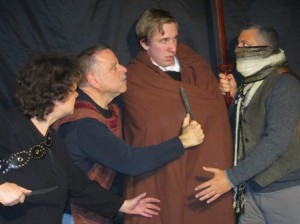 Outlaws threaten Valentine (Kris Varga) as he makes his way through the forest. (Left to right: Michelle Campanas, Donald Hallcom, Kris Varga, Angelo Ragonesi.) (Photo credit: Ruth Rouff)