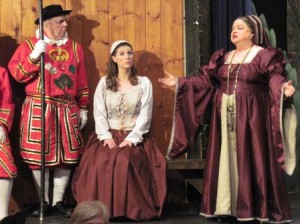 Dame Carruthers (played by Martha Smylie of West Chester, PA) sings “When Our Gallant Norman Foes” to Phoebe Meryll (played by Paula Gonzalez of Newark, DE) while a Yeoman (Bruce Wyman of Media, PA) listens on in The Ardensingers' THE YEOMEN OF THE GUARD.