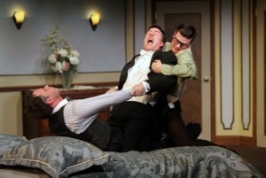 Jeffrey Coon (Tito. in bed), Tony Braithwaite (Saunders) and Michael Doherty (Max) in LEND ME A TENOR at Act II Playhouse. (Photo credit: Bill D'Agostino)