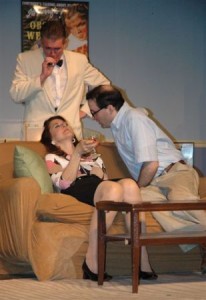 Mare Mikalic, James Lewis, (standing) Jeff Ragan in a scene from The Stagecrafters' PLAY IT AGAIN, SAM.